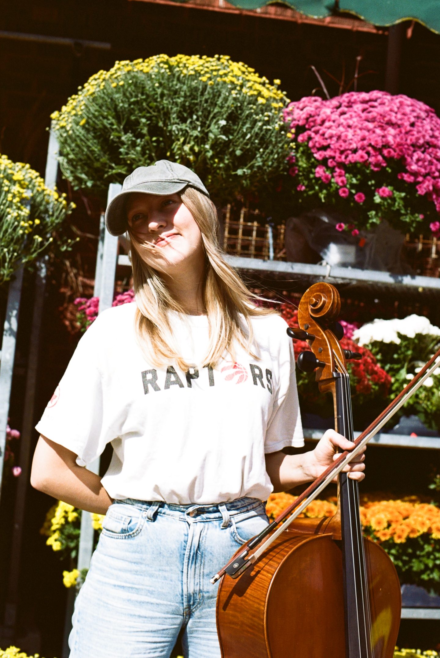 Eliza Niemi smiling in front of flowers