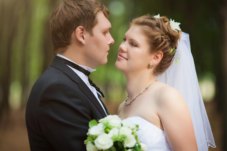 Bride and groom on their wedding day, representing the personal aspect of mail-order marriages